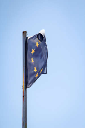 A Europe flag fluttering on the flagpole in the windの写真素材