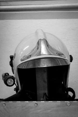 Helmets of firefighters, fire helmet are at hand parked