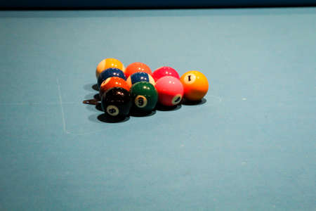 Scenes from billiards, colorful numbered balls on tables and other utensils