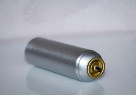 A inclusion of a metal spray can
