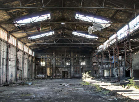 View of an old abandoned and half dilapidated factory buildingの写真素材