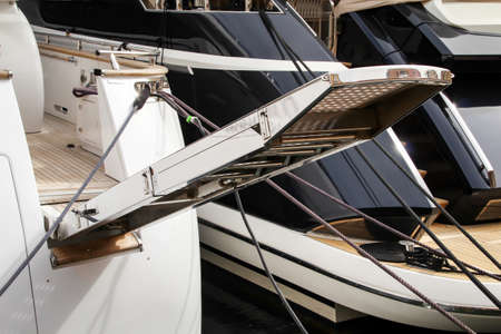 Detailed views of a sailing yacht lying in the harbor.