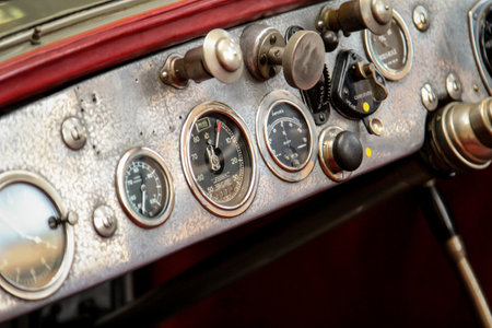 A partial view of a vintage, auto.
