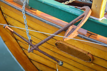 Details of a sailboat. A sailboat with a hull made of the finest machined wood, anchor and rudder.の写真素材