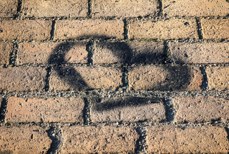 A heart on a brick surface. Heart texture.の写真素材