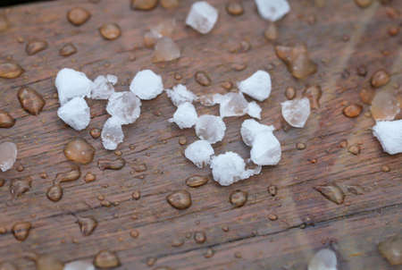 Lots of hailstones immediately after the impact. Hailstones can cause great damage.の写真素材