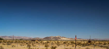 View of the desert in Nevada. Lots of sand, mountains and little vegetation.の写真素材