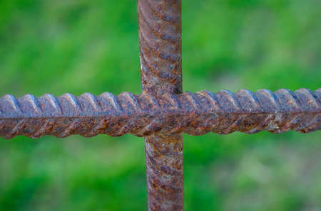 A cross made of two reinforcing bars. Reinforcing steel for strengthening concrete.の写真素材