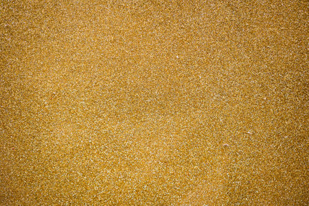 A texture of golden glitter for special moments.の写真素材