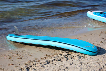 Details of a stand up paddle board lying on the beach. Stand Up Paddle Board.の写真素材