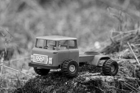 An old thrown away car, toy car in nature, probably of Russian origin.の写真素材