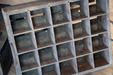 View of a very old beer crate made of thin wooden boards.
