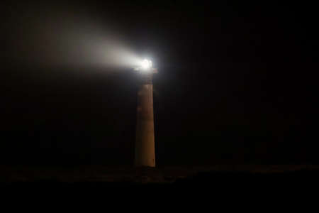 A lighthouse that at night gives the ships the position by means of light.の写真素材