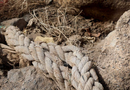 A carelessly thrown away old rope from a cutter, ship.