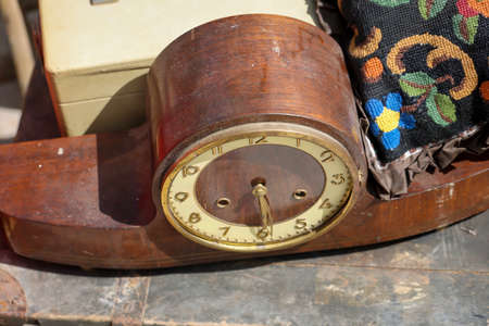Picture of an old mechanical clock which often stood in the middle on a cabinet.の写真素材