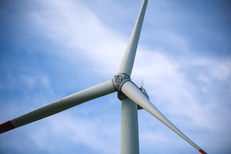 Close-up of the hub of a wind turbine. Blade and hub of a wind turbine.