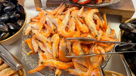 Shrimp and prawns in a bowl on a buffet.の写真素材