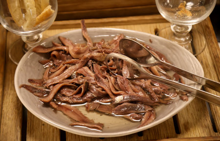 There are many sprats in a bowl on the buffet.の写真素材
