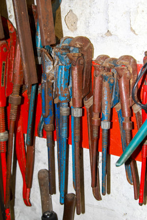 Pipe wrenches in a workshop.の写真素材
