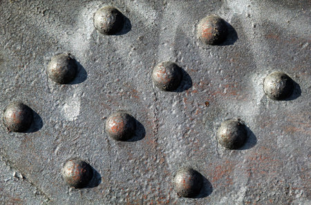 Steel girder with rivets. Metal texture with rivets, close-up. Industrial background.の写真素材