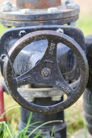 A stopcock on an irrigation system for field plants.の写真素材
