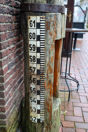 The water level gauge, level indicator near the river.の写真素材