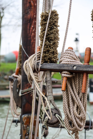 Details of a cutter, a ship, a sailing ship. Ropes of an old sailing ship in the Netherlands.の写真素材
