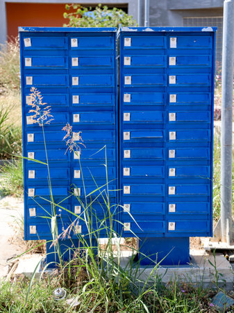Blue mailbox tower at the roadside.