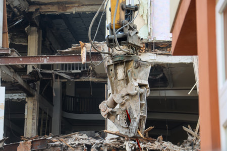 Detail of an excavator at a construction site. Demolition of an old building, in the city of Seoul, South Koreaの写真素材