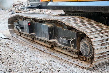 Detail of an excavator at a construction site. Part of the excavator at the construction site, close-upの写真素材