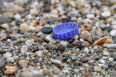 Plastic waste on the beach that creates microplastics.の写真素材