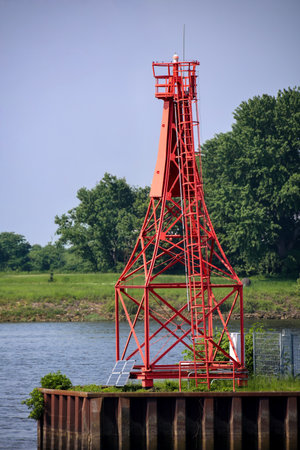 A lighthouse at a harbor.の写真素材