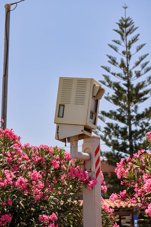 A speed camera on a highway.