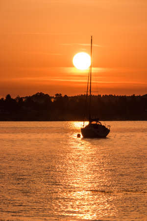 Sailing into the sunset Chiemsee Bavaria Germanyの写真素材