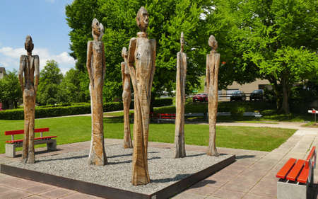 group  of high  wooden sculpture in a public parcの写真素材