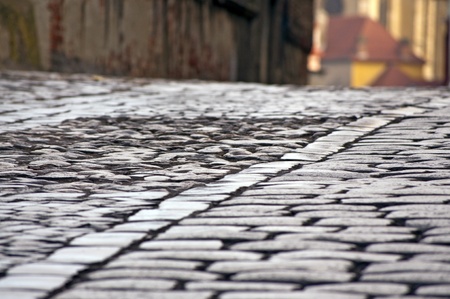 Old cobblestone and sett street on hillの写真素材