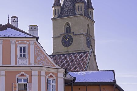 Sibiu, Transylvania, Romania, steeple of lutheran cathedral and 'Luxemburger House'の写真素材
