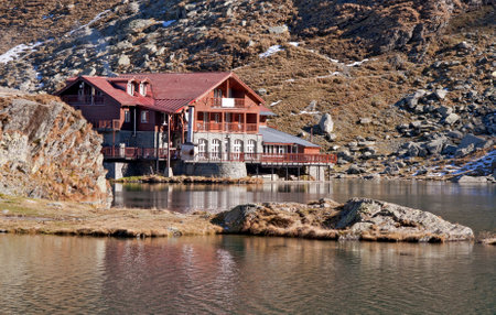 Balea Lac chalet on lake in Fagaras Mountains, Sibiu county, Romaniaのeditorial素材