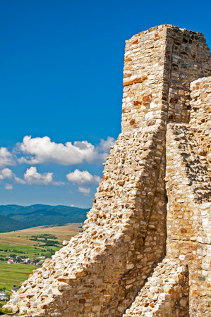Ruined stone wall at Cetatea Neamtului fortress in Romaniaのeditorial素材