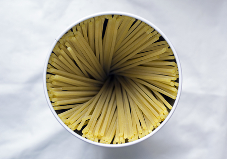 Spaghetti raw in tin can, natural lightの写真素材