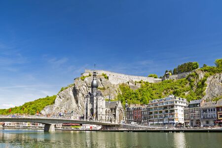 Church and citadel in Dinant, Belgiumの写真素材