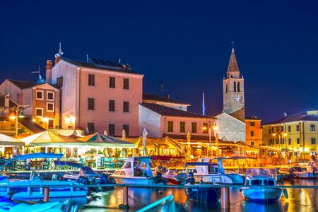 Fazana, Istria, Croatia promenade, restaurants and church by night の写真素材