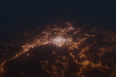 Aerial shot of Hiroshima (Japan) at night, view from south. Imitation of satellite view on modern city with street lights and glow effect. 3d render, high resolutionの写真素材