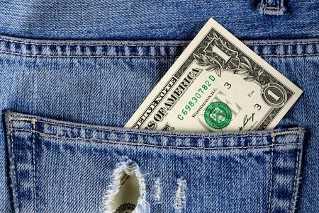 Dollar bill in jeans pocket