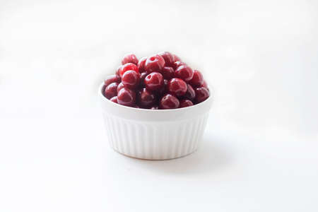 Red cherries laid out in even rows. Background. Harvest of red cherries in a season.の写真素材