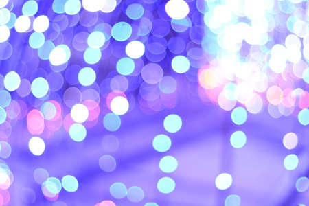 Blue and white colored light bokeh. Blurred bokech background with deep light purple color.