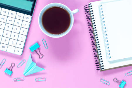 Calculator with cup of coffe isolated on white and purple background. Business and educate concept....