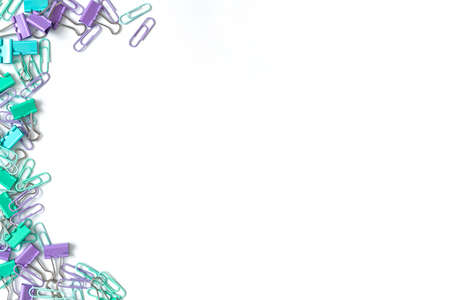 Multi-colored paper clips on a white background. Place for your text. Top view.の写真素材