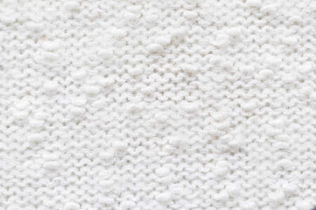 Knitted loops background. Knitted texture. White Knitted Fabric Texture. White knitting wool texture...