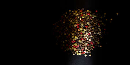 Five kinds of pepper close up. Texture of various peppers. Seasonings and spices from colored...
